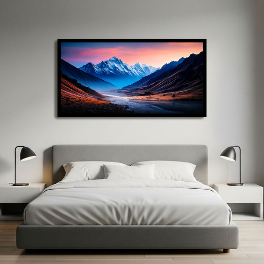 Modern bedroom with a bed, nightstands, and a framed mountain landscape on the wall.